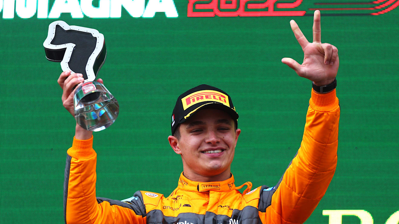 IMOLA, ITALY - APRIL 24: Third placed Lando Norris of Great Britain and McLaren celebrates on the podium during the F1 Grand Prix of Emilia Romagna at Autodromo Enzo e Dino Ferrari on April 24, 2022 in Imola, Italy. (Photo by Lars Baron - Formula 1/Formula 1 via Getty Images)