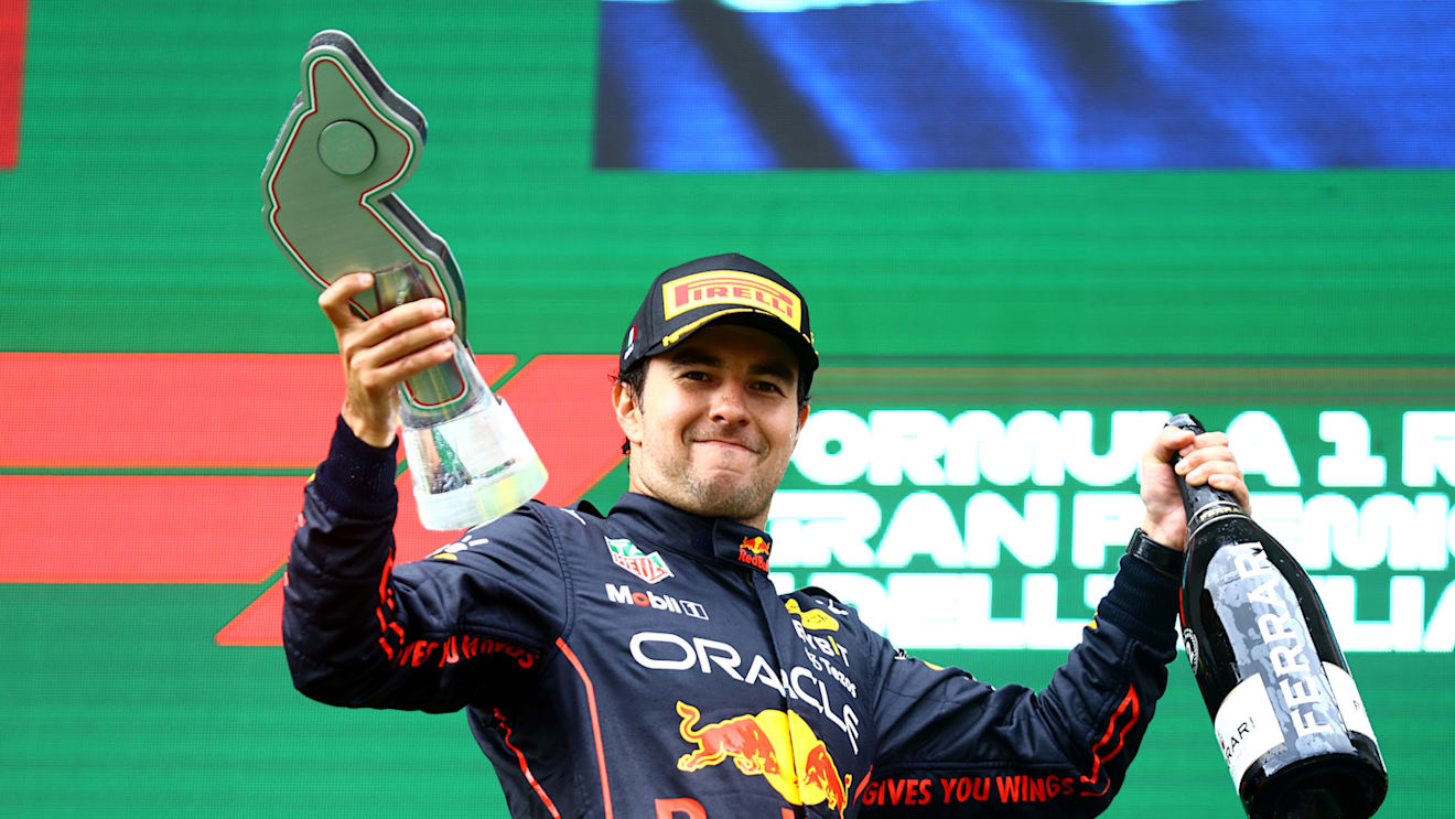 IMOLA, ITALY - APRIL 24: Second placed Sergio Perez of Mexico and Oracle Red Bull Racing celebrates on the podium during the F1 Grand Prix of Emilia Romagna at Autodromo Enzo e Dino Ferrari on April 24, 2022 in Imola, Italy. (Photo by Mark Thompson/Getty Images)