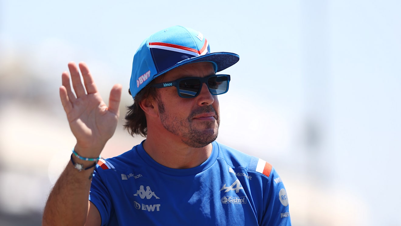 LE CASTELLET, FRANCE - JULY 24: Fernando Alonso of Spain and Alpine F1 waves to the crowd on the drivers parade ahead of the F1 Grand Prix of France at Circuit Paul Ricard on July 24, 2022 in Le Castellet, France. (Photo by Clive Rose/Getty Images)