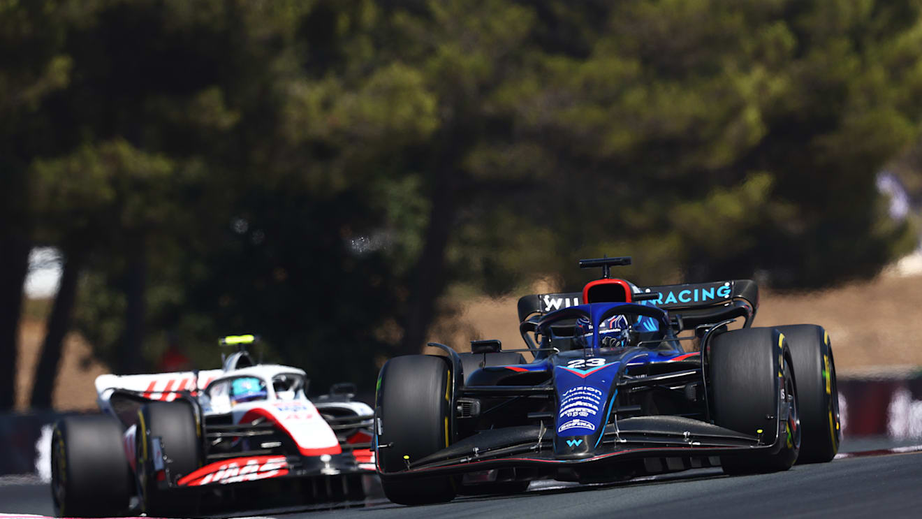 LE CASTELLET, FRANCE - JULY 24: Alexander Albon of Thailand driving the (23) Williams FW44 Mercedes leads Mick Schumacher of Germany driving the (47) Haas F1 VF-22 Ferrari during the F1 Grand Prix of France at Circuit Paul Ricard on July 24, 2022 in Le Castellet, France. (Photo by Clive Rose/Getty Images)