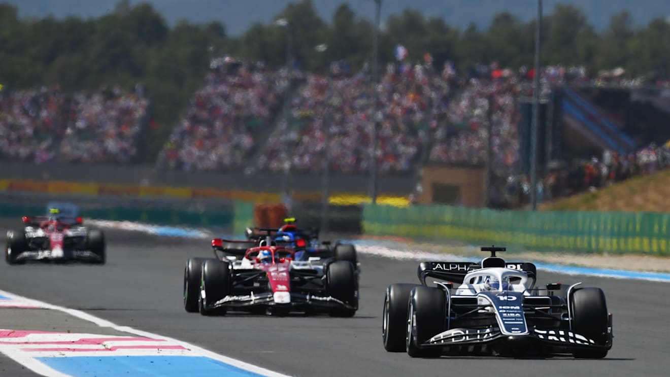 LE CASTELLET, FRANCE - JULY 24: Pierre Gasly of France driving the (10) Scuderia AlphaTauri AT03 leads Valtteri Bottas of Finland driving the (77) Alfa Romeo F1 C42 Ferrari during the F1 Grand Prix of France at Circuit Paul Ricard on July 24, 2022 in Le Castellet, France. (Photo by Dan Mullan/Getty Images)