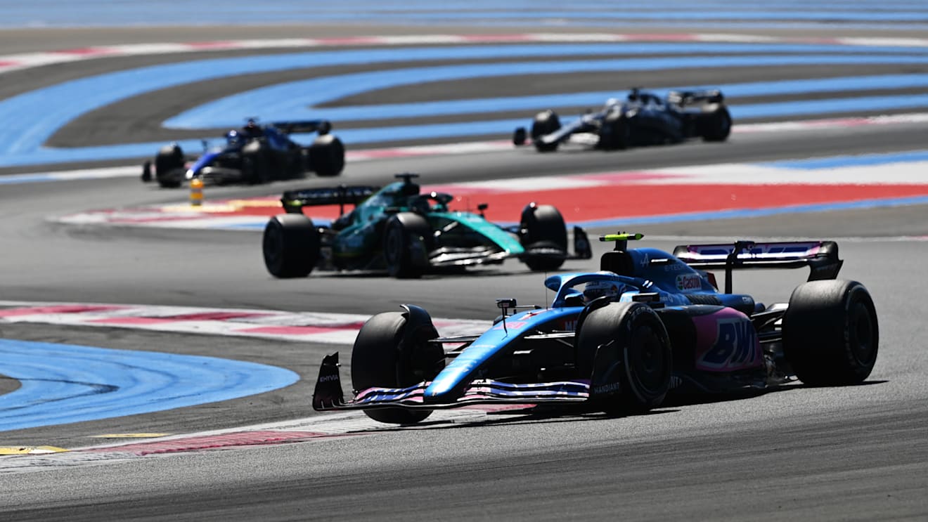 LE CASTELLET, FRANCE - JULY 24: Esteban Ocon of France driving the (31) Alpine F1 A522 Renault leads Lance Stroll of Canada driving the (18) Aston Martin AMR22 Mercedes during the F1 Grand Prix of France at Circuit Paul Ricard on July 24, 2022 in Le Castellet, France. (Photo by Dan Mullan/Getty Images)