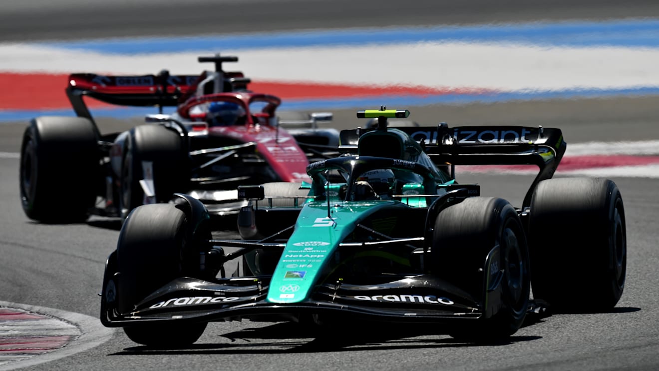 LE CASTELLET, FRANCE - JULY 24: Sebastian Vettel of Germany driving the (5) Aston Martin AMR22 Mercedes leads Valtteri Bottas of Finland driving the (77) Alfa Romeo F1 C42 Ferrari during the F1 Grand Prix of France at Circuit Paul Ricard on July 24, 2022 in Le Castellet, France. (Photo by Dan Mullan/Getty Images)