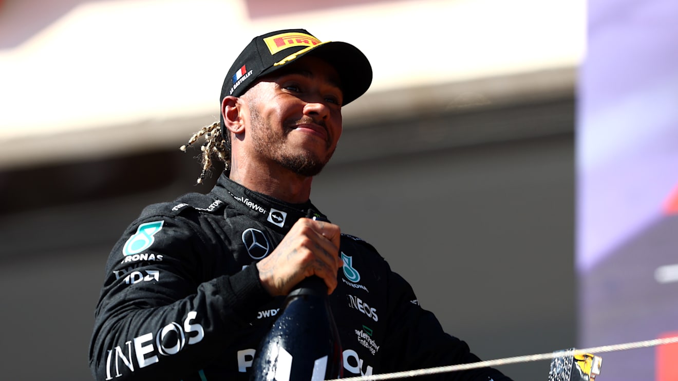 LE CASTELLET, FRANCE - JULY 24: Second placed Lewis Hamilton of Great Britain and Mercedes celebrates on the podium during the F1 Grand Prix of France at Circuit Paul Ricard on July 24, 2022 in Le Castellet, France. (Photo by Clive Rose/Getty Images)