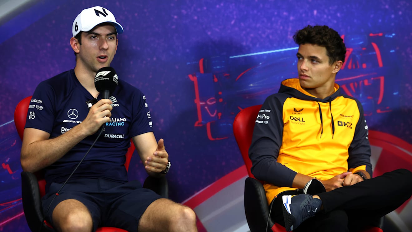 LE CASTELLET, FRANCE - JULY 21: Nicholas Latifi of Canada and Williams and Lando Norris of Great Britain and McLaren talk in the Drivers Press Conference during previews ahead of the F1 Grand Prix of France at Circuit Paul Ricard on July 21, 2022 in Le Castellet, France. (Photo by Bryn Lennon/Getty Images)