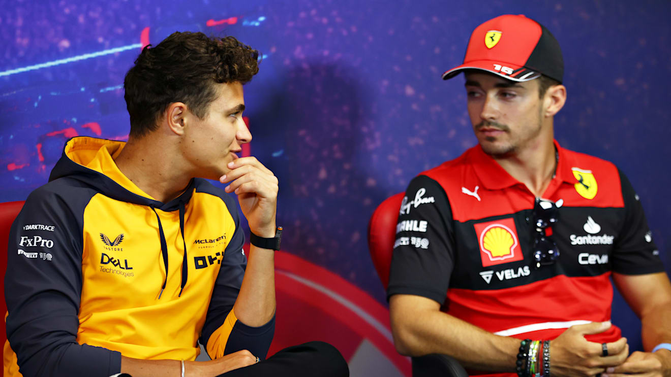 LE CASTELLET, FRANCE - JULY 21: Lando Norris of Great Britain and McLaren and Charles Leclerc of Monaco and Ferrari talk in the Drivers Press Conference during previews ahead of the F1 Grand Prix of France at Circuit Paul Ricard on July 21, 2022 in Le Castellet, France. (Photo by Bryn Lennon/Getty Images)