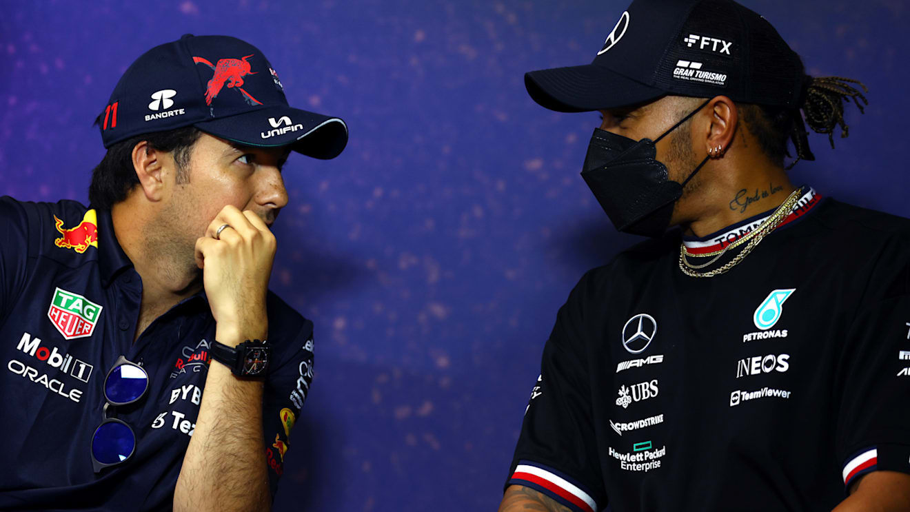 LE CASTELLET, FRANCE - JULY 21: Sergio Perez of Mexico and Oracle Red Bull Racing and Lewis Hamilton of Great Britain and Mercedes talk in the Drivers Press Conference during previews ahead of the F1 Grand Prix of France at Circuit Paul Ricard on July 21, 2022 in Le Castellet, France. (Photo by Bryn Lennon/Getty Images)