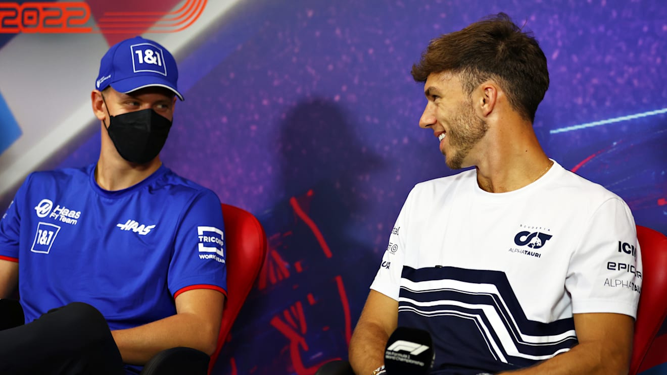 LE CASTELLET, FRANCE - JULY 21: Pierre Gasly of France and Scuderia AlphaTauri and Mick Schumacher of Germany and Haas F1 talk in the Drivers Press Conference during previews ahead of the F1 Grand Prix of France at Circuit Paul Ricard on July 21, 2022 in Le Castellet, France. (Photo by Bryn Lennon/Getty Images)