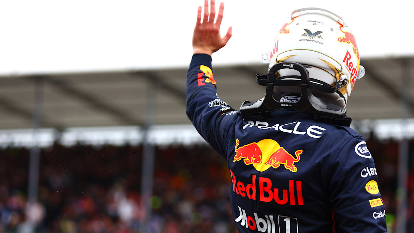 NORTHAMPTON, ENGLAND - JULY 02: Second placed qualifier Max Verstappen of the Netherlands and Oracle Red Bull Racing waves to the crowd in parc ferme during qualifying ahead of the F1 Grand Prix of Great Britain at Silverstone on July 02, 2022 in Northampton, England. (Photo by Mark Thompson/Getty Images)