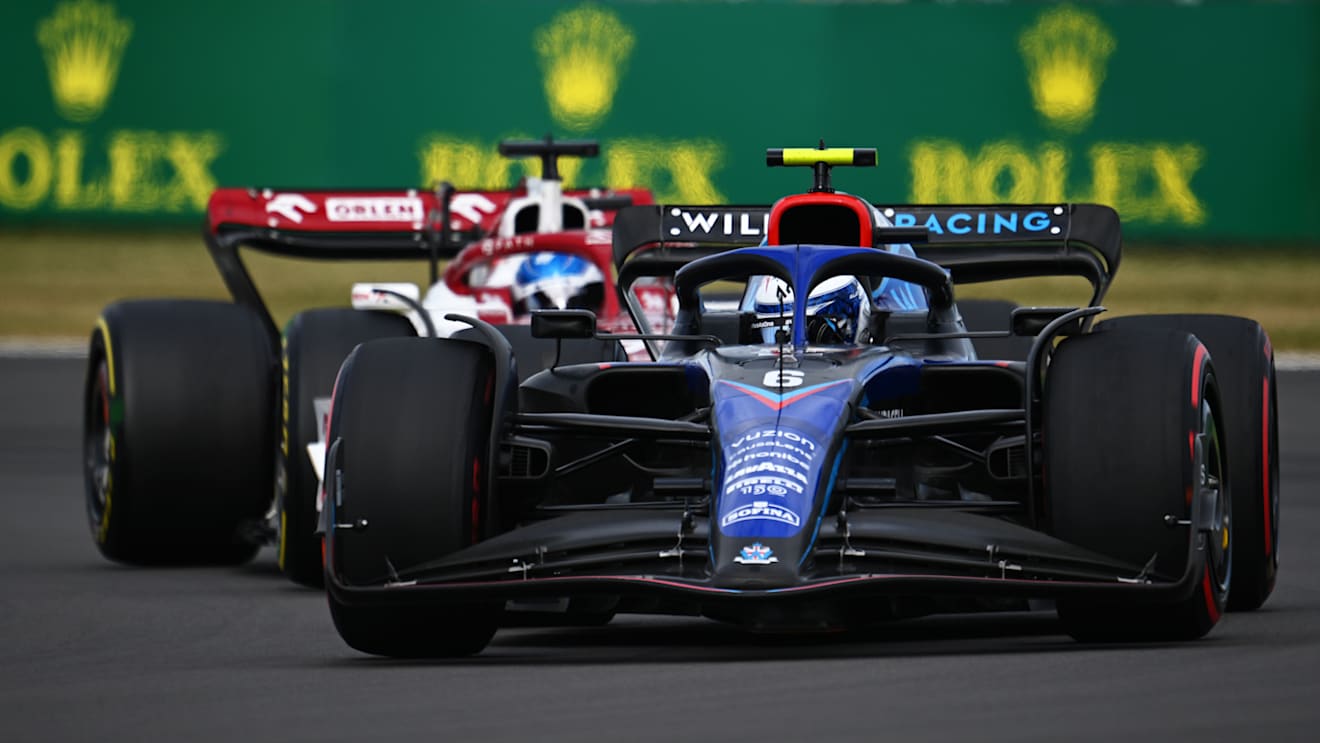 NORTHAMPTON, ENGLAND - JULY 03: Nicholas Latifi of Canada driving the (6) Williams FW44 Mercedes leads Valtteri Bottas of Finland driving the (77) Alfa Romeo F1 C42 Ferrari on track during the F1 Grand Prix of Great Britain at Silverstone on July 03, 2022 in Northampton, England. (Photo by Clive Mason/Getty Images)