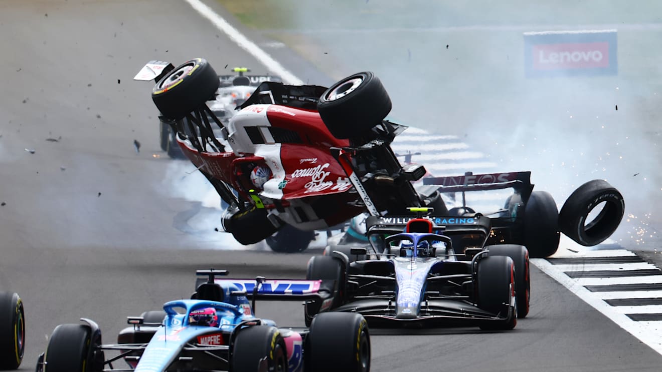 NORTHAMPTON, ENGLAND - JULY 03: Zhou Guanyu of China driving the (24) Alfa Romeo F1 C42 Ferrari crashes at the start during the F1 Grand Prix of Great Britain at Silverstone on July 03, 2022 in Northampton, England. (Photo by Mark Thompson/Getty Images)