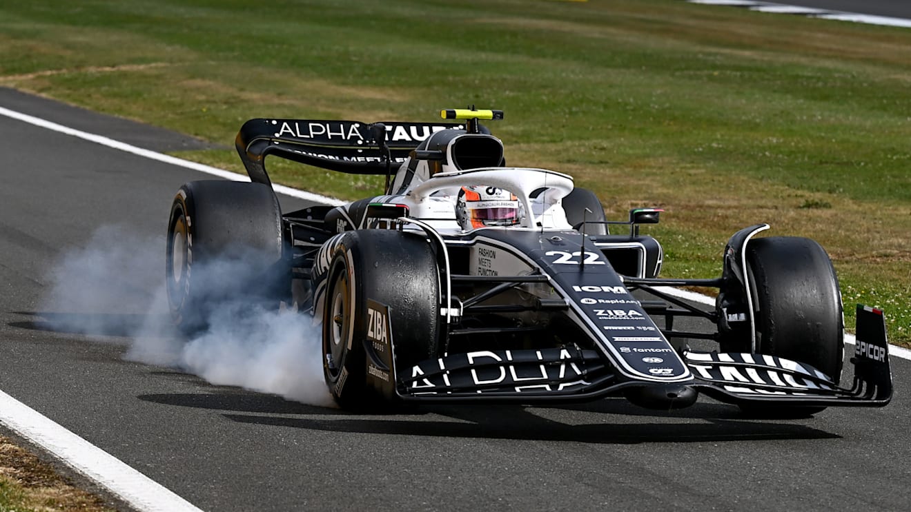 NORTHAMPTON, ENGLAND - JULY 03: Yuki Tsunoda of Japan driving the (22) Scuderia AlphaTauri AT03 locks a wheel under braking during the F1 Grand Prix of Great Britain at Silverstone on July 03, 2022 in Northampton, England. (Photo by Clive Mason/Getty Images)