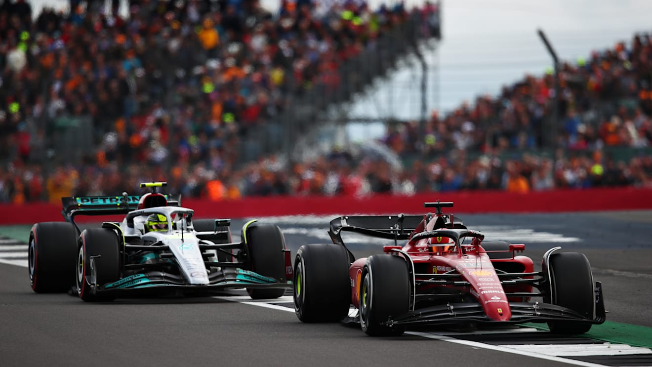 NORTHAMPTON, ENGLAND - JULY 03: Charles Leclerc of Monaco driving the (16) Ferrari F1-75 leads Lewis Hamilton of Great Britain driving the (44) Mercedes AMG Petronas F1 Team W13 during the F1 Grand Prix of Great Britain at Silverstone on July 03, 2022 in Northampton, England. (Photo by Joe Portlock - Formula 1/Formula 1 via Getty Images)