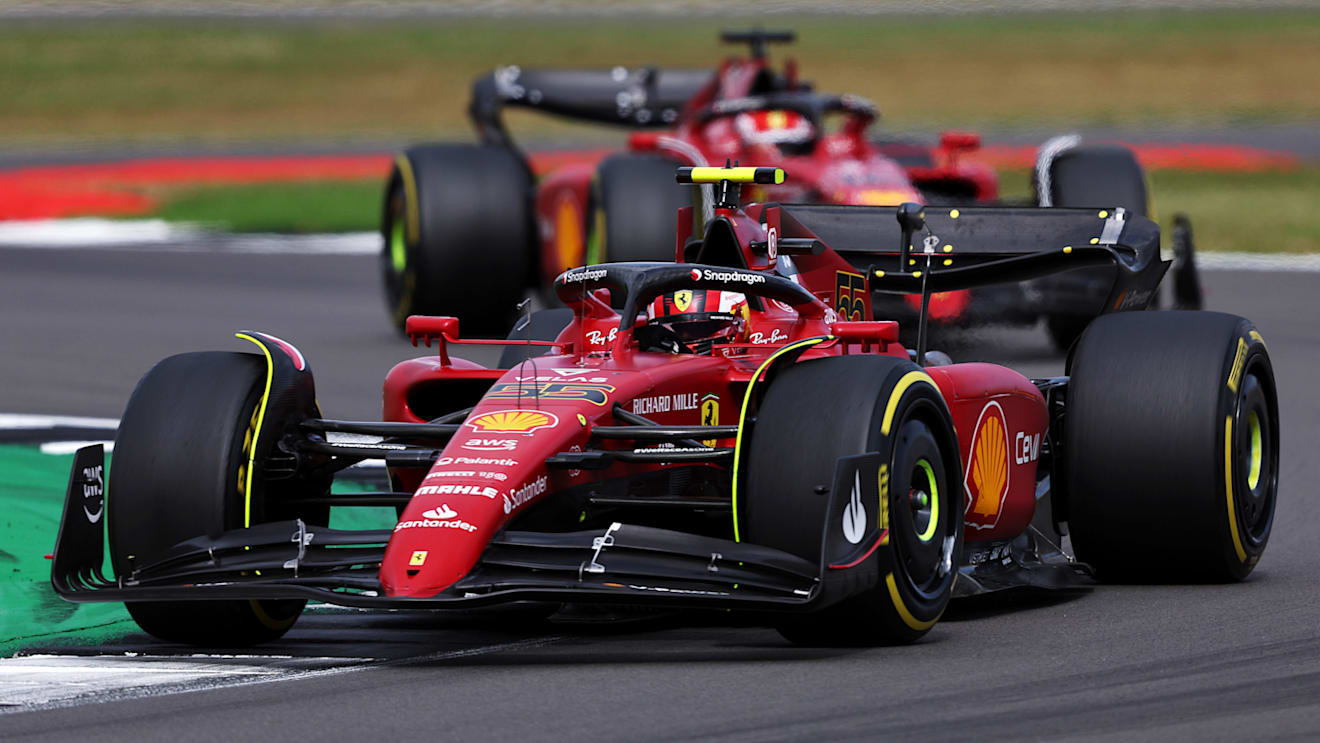 NORTHAMPTON, ENGLAND - JULY 03: Carlos Sainz of Spain driving (55) the Ferrari F1-75 ahead of Charles Leclerc of Monaco driving (16) the Ferrari F1-75 during the F1 Grand Prix of Great Britain at Silverstone on July 03, 2022 in Northampton, England. (Photo by Bryn Lennon - Formula 1/Formula 1 via Getty Images)