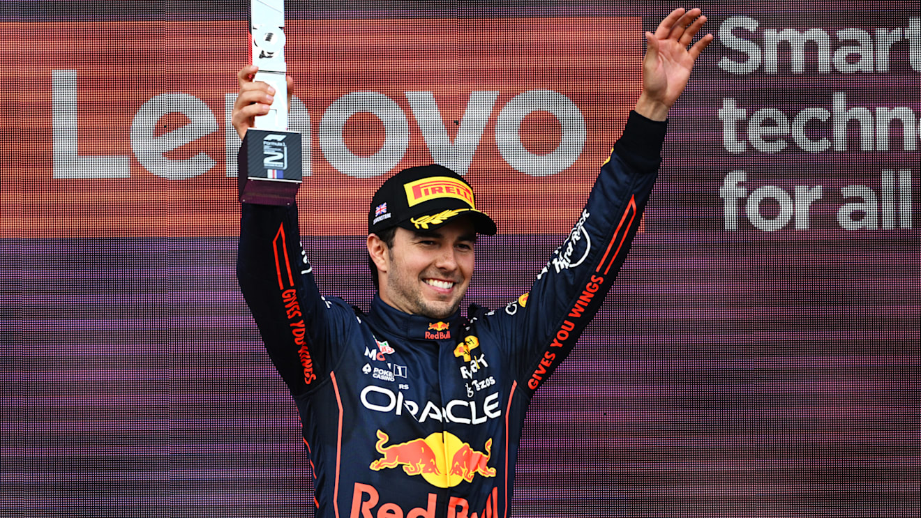 NORTHAMPTON, ENGLAND - JULY 03: Second placed Sergio Perez of Mexico and Oracle Red Bull Racing celebrates on the podium during the F1 Grand Prix of Great Britain at Silverstone on July 03, 2022 in Northampton, England. (Photo by Clive Mason/Getty Images)