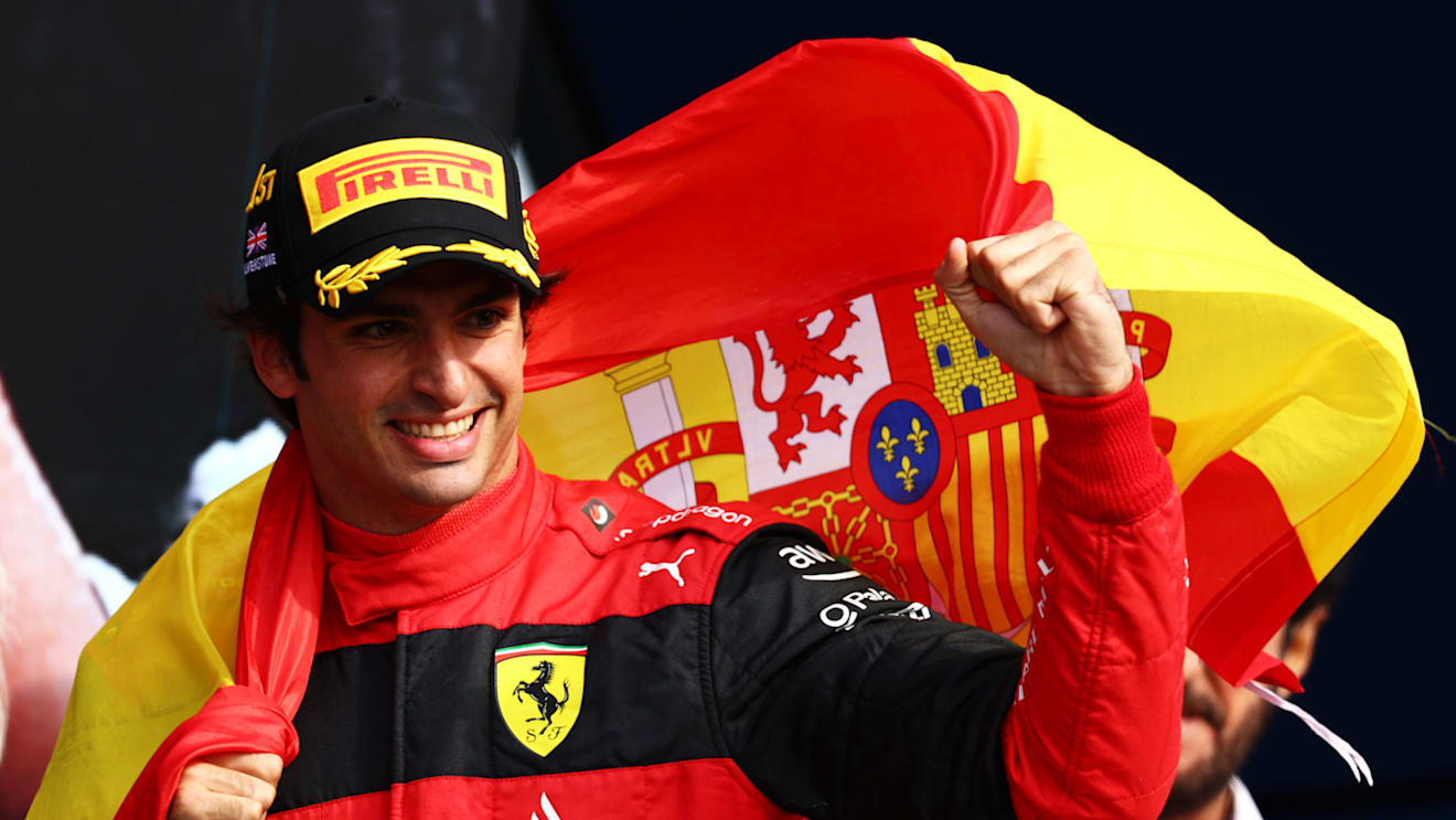 NORTHAMPTON, ENGLAND - JULY 03: Race winner Carlos Sainz of Spain and Ferrari celebrates on the podium during the F1 Grand Prix of Great Britain at Silverstone on July 03, 2022 in Northampton, England. (Photo by Clive Rose/Getty Images)