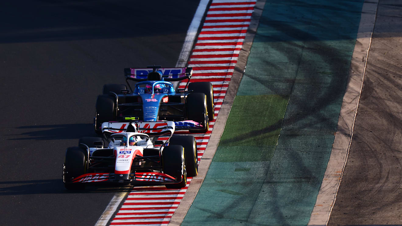 BUDAPEST, HUNGARY - JULY 29: Mick Schumacher of Germany driving the (47) Haas F1 VF-22 Ferrari leads Fernando Alonso of Spain driving the (14) Alpine F1 A522 Renault  during practice ahead of the F1 Grand Prix of Hungary at Hungaroring on July 29, 2022 in Budapest, Hungary. (Photo by Dan Istitene - Formula 1/Formula 1 via Getty Images)