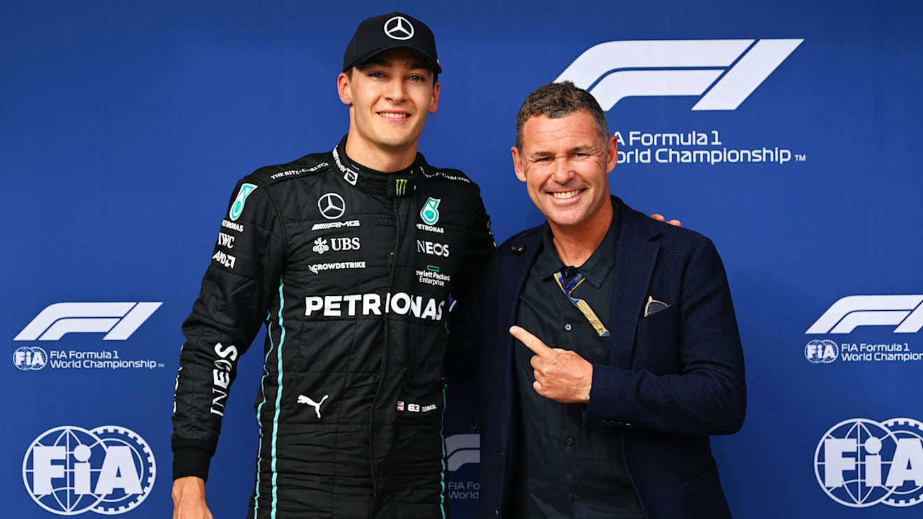 BUDAPEST, HUNGARY - JULY 30: Pole position qualifier George Russell of Great Britain and Mercedes is presented with the Pirelli Pole Position trophy by Tom Kristensen during qualifying ahead of the F1 Grand Prix of Hungary at Hungaroring on July 30, 2022 in Budapest, Hungary. (Photo by Dan Mullan/Getty Images)