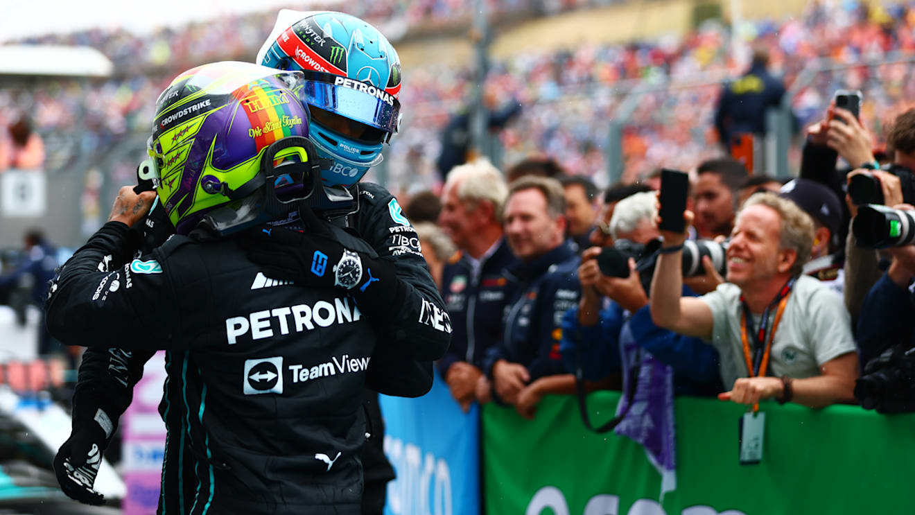 BUDAPEST, HUNGARY - JULY 31: 2pm Lewis Hamilton of Great Britain and Mercedes and Third placed George Russell of Great Britain and Mercedes celebrate in parc ferme during the F1 Grand Prix of Hungary at Hungaroring on July 31, 2022 in Budapest, Hungary. (Photo by Dan Istitene - Formula 1/Formula 1 via Getty Images)
