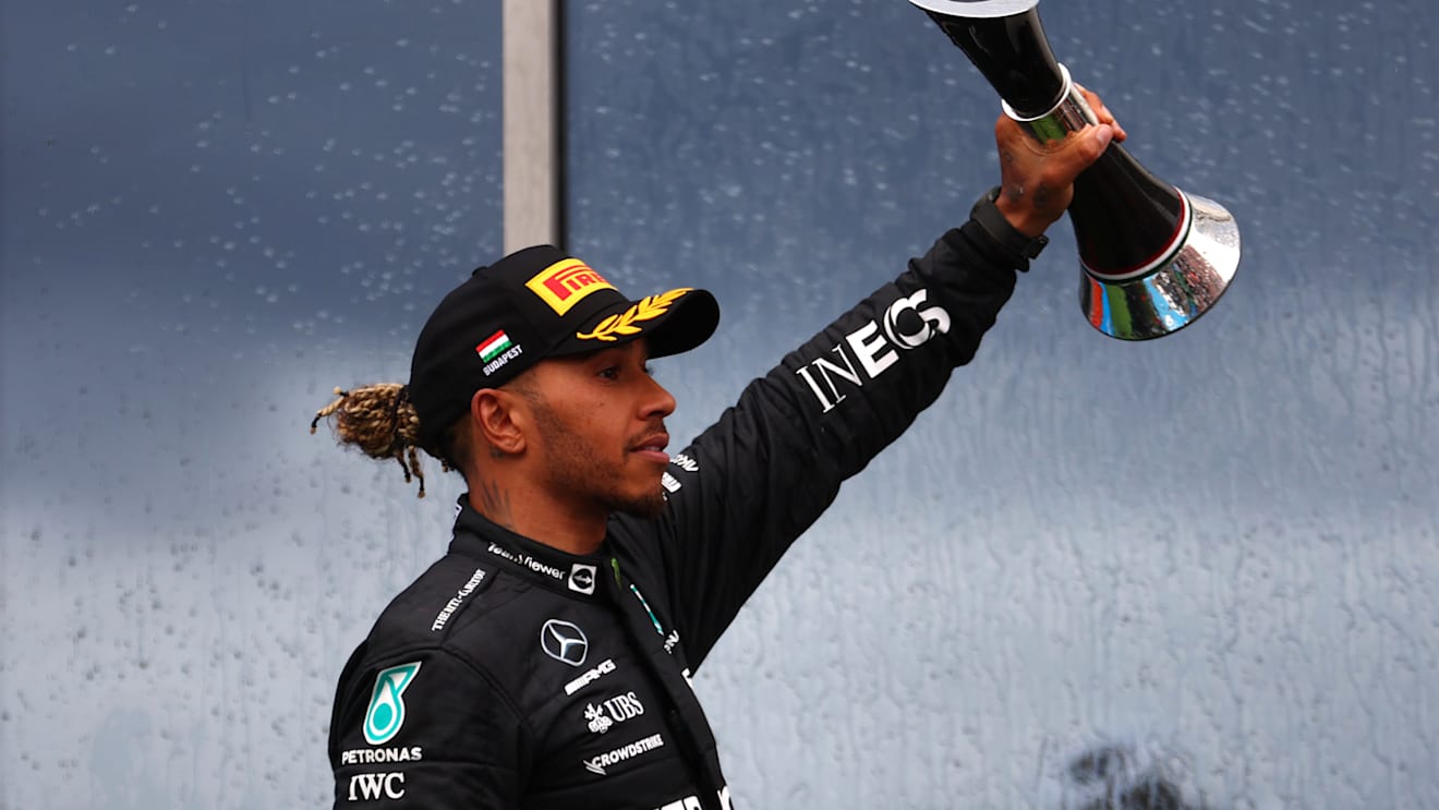 BUDAPEST, HUNGARY - JULY 31: Second placed Lewis Hamilton of Great Britain and Mercedes celebrates on the podium during the F1 Grand Prix of Hungary at Hungaroring on July 31, 2022 in Budapest, Hungary. (Photo by Bryn Lennon - Formula 1/Formula 1 via Getty Images)