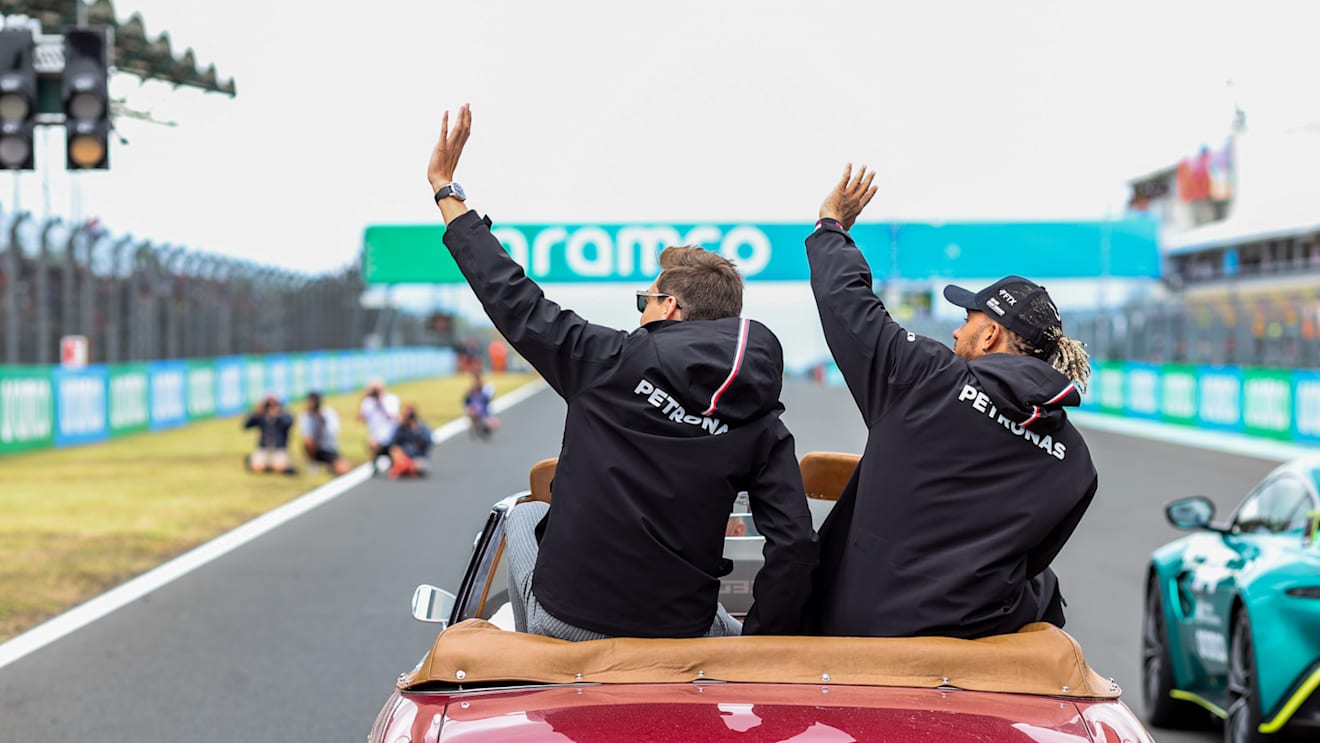 BUDAPEST, HUNGARY - JULY 31: George Russell and Lewis Hamilton of Mercedes and Great Britain during the drivers parade lap at the F1 Grand Prix of Hungary at Hungaroring on July 31, 2022 in Budapest, Hungary. (Photo by Peter Fox/Getty Images)