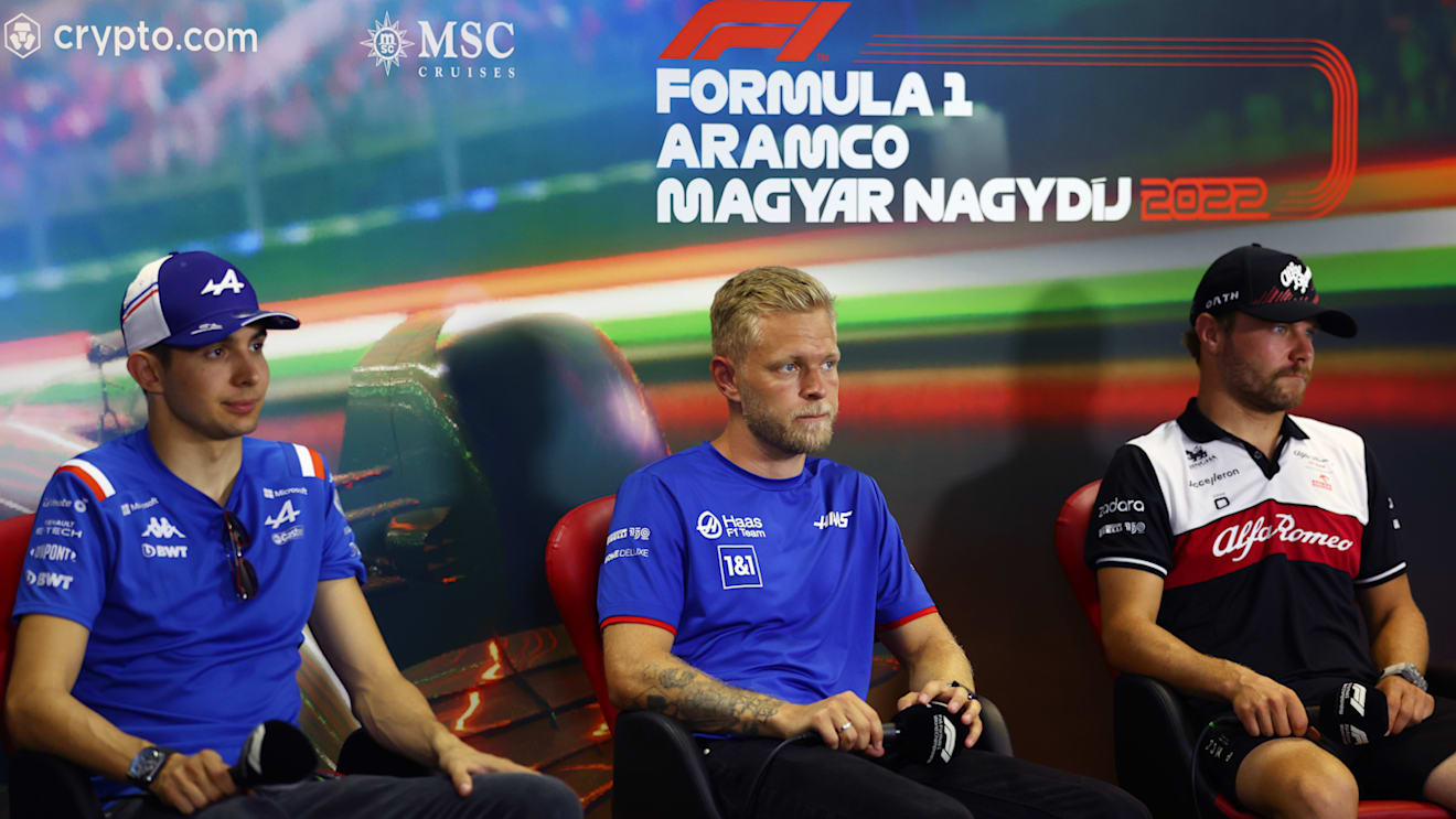 BUDAPEST, HUNGARY - JULY 28: Esteban Ocon of France and Alpine F1, Kevin Magnussen of Denmark and Haas F1 and Valtteri Bottas of Finland and Alfa Romeo F1 look on in the Drivers Press Conference during previews ahead of the F1 Grand Prix of Hungary at Hungaroring on July 28, 2022 in Budapest, Hungary. (Photo by Bryn Lennon/Getty Images)