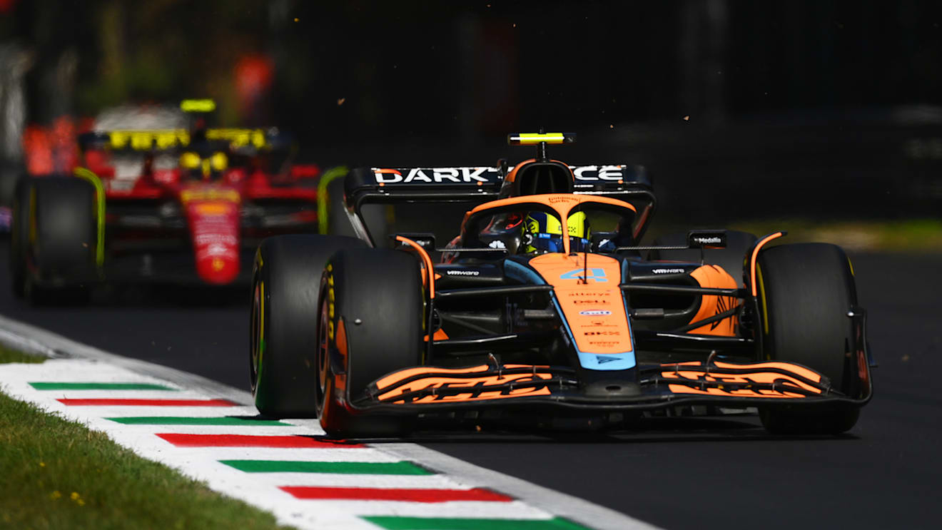 MONZA, ITALY - SEPTEMBER 11: Lando Norris of Great Britain driving the (4) McLaren MCL36 Mercedes leads Carlos Sainz of Spain driving (55) the Ferrari F1-75 during the F1 Grand Prix of Italy at Autodromo Nazionale Monza on September 11, 2022 in Monza, Italy. (Photo by Dan Mullan/Getty Images)
