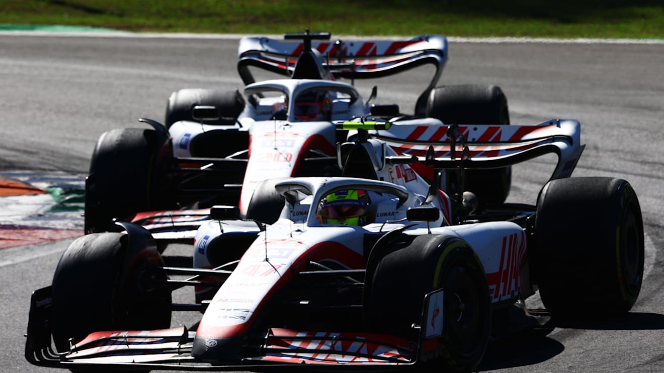 MONZA, ITALY - SEPTEMBER 11: Mick Schumacher of Germany driving the (47) Haas F1 VF-22 Ferrari leads Kevin Magnussen of Denmark driving the (20) Haas F1 VF-22 Ferrari during the F1 Grand Prix of Italy at Autodromo Nazionale Monza on September 11, 2022 in Monza, Italy. (Photo by Mark Thompson/Getty Images)
