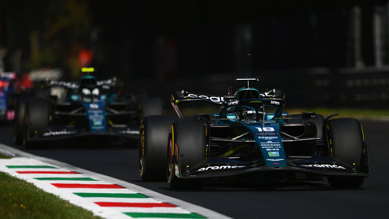 MONZA, ITALY - SEPTEMBER 11: Lance Stroll of Canada driving the (18) Aston Martin AMR22 Mercedes leads Sebastian Vettel of Germany driving the (5) Aston Martin AMR22 Mercedes during the F1 Grand Prix of Italy at Autodromo Nazionale Monza on September 11, 2022 in Monza, Italy. (Photo by Dan Mullan/Getty Images)