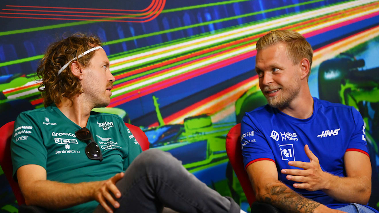 MONZA, ITALY - SEPTEMBER 08: Sebastian Vettel of Germany and Aston Martin F1 Team and Kevin Magnussen of Denmark and Haas F1 attend the drivers press conference during previews ahead of the F1 Grand Prix of Italy at Autodromo Nazionale Monza on September 08, 2022 in Monza, Italy. (Photo by Dan Mullan/Getty Images)