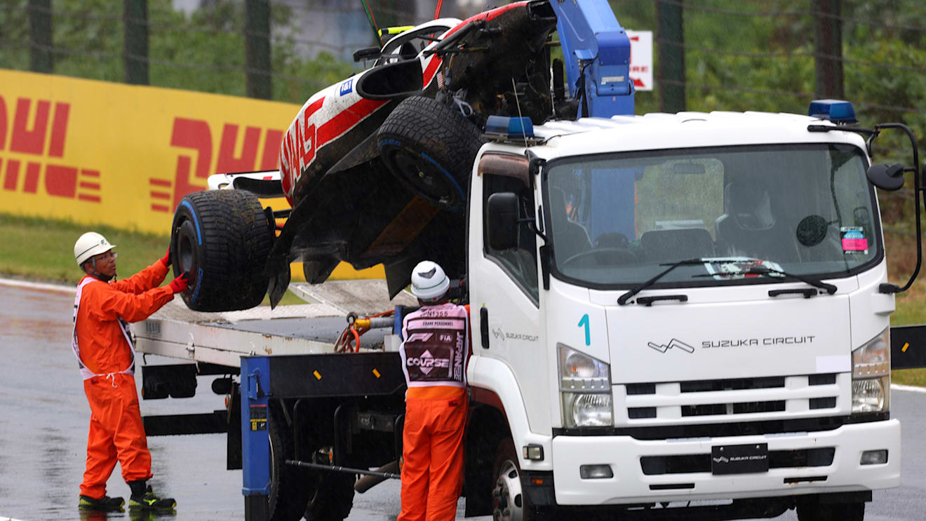 SUZUKA, JAPAN - OCTOBER 07: The car of Mick Schumacher of Germany and Haas F1 is collected from the track after a crash during practice ahead of the F1 Grand Prix of Japan at Suzuka International Racing Course on October 07, 2022 in Suzuka, Japan. (Photo by Dan Istitene - Formula 1/Formula 1 via Getty Images)