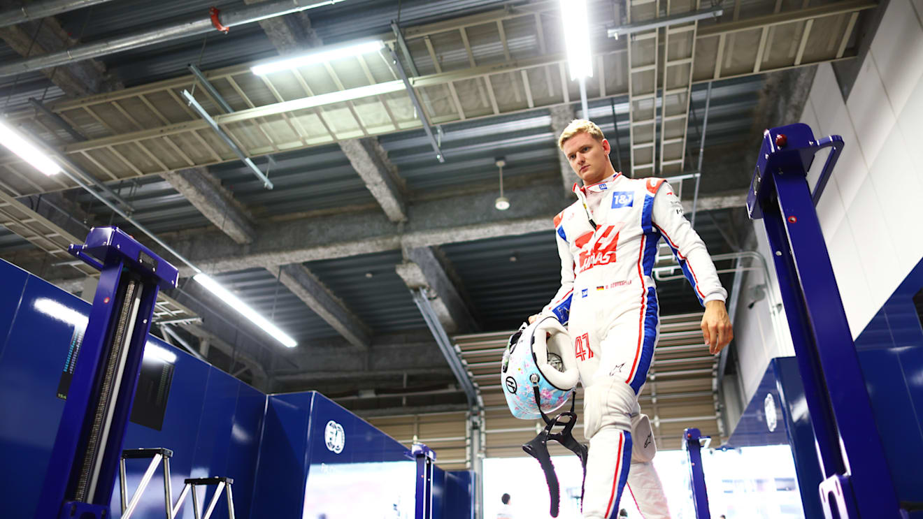 SUZUKA, JAPAN - OCTOBER 08: Fifteenth placed qualifier Mick Schumacher of Germany and Haas F1 is weighed in the FIA garage during qualifying ahead of the F1 Grand Prix of Japan at Suzuka International Racing Course on October 08, 2022 in Suzuka, Japan. (Photo by Dan Istitene - Formula 1/Formula 1 via Getty Images)