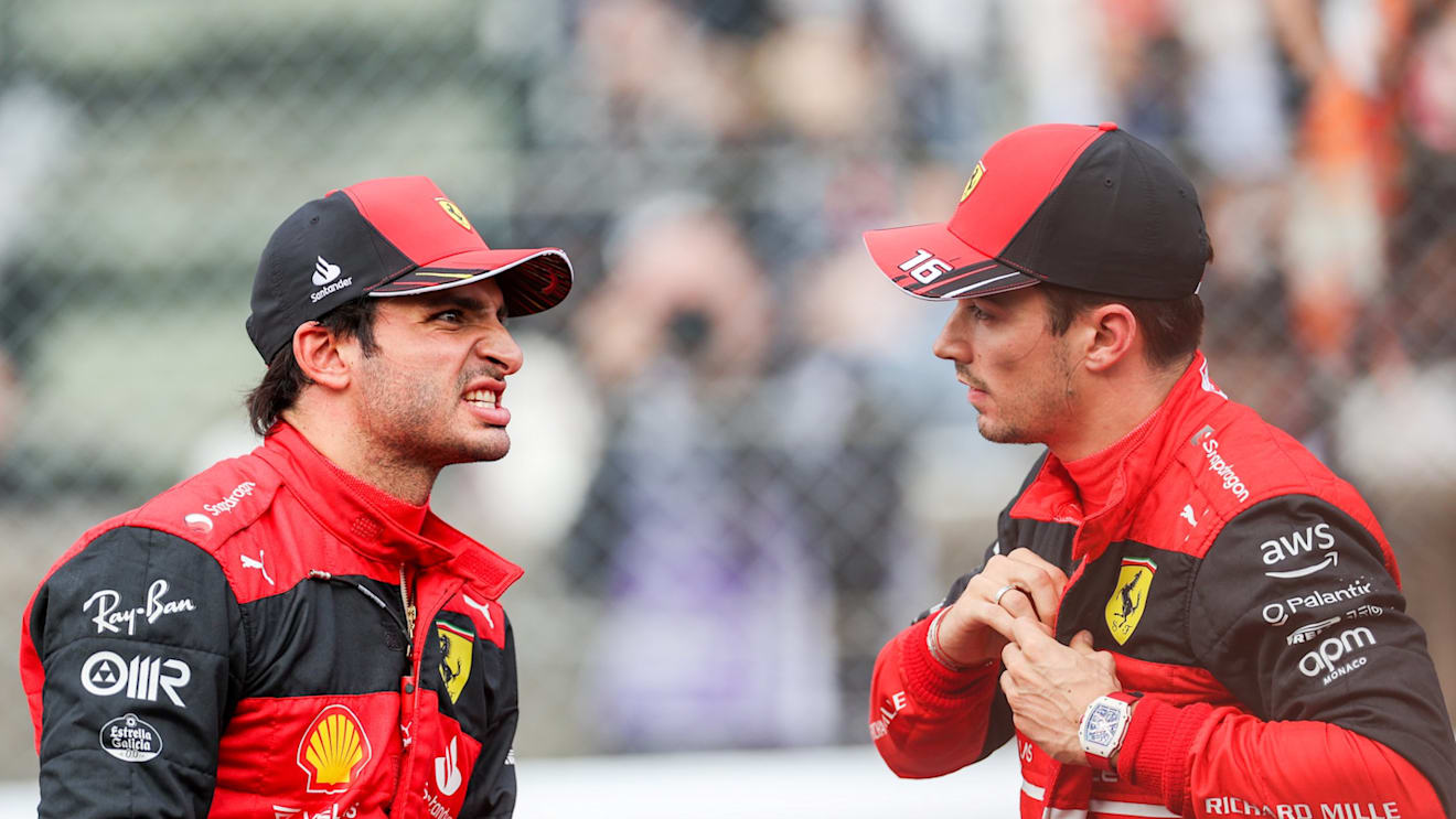 SUZUKA, JAPAN - OCTOBER 08: Carlos Sainz of Ferrari and Spain chats with Charles Leclerc of Ferrari and Monaco during qualifying ahead of the F1 Grand Prix of Japan at Suzuka International Racing Course on October 08, 2022 in Suzuka, Japan. (Photo by Peter Fox/Getty Images )