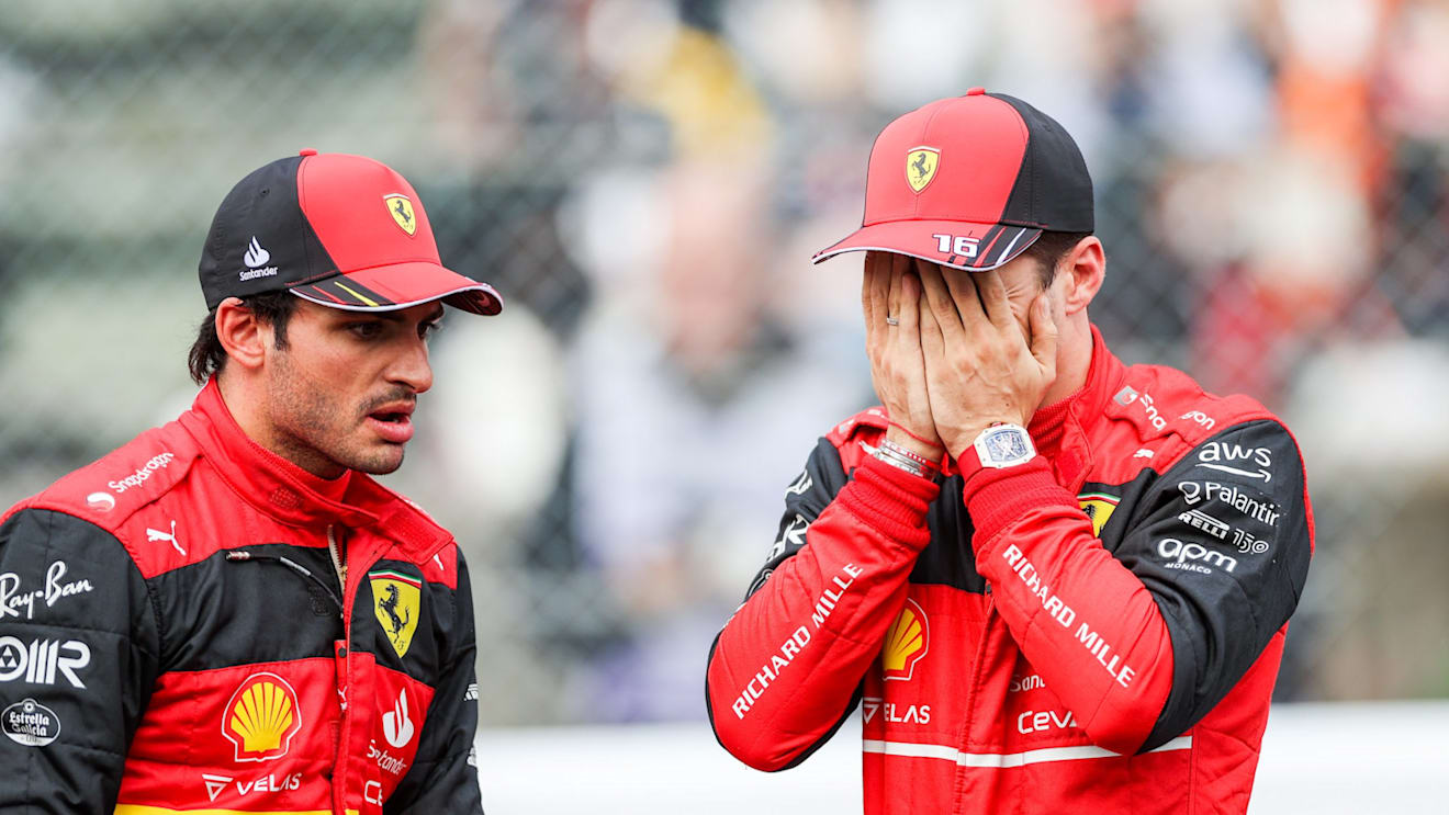 SUZUKA, JAPAN - OCTOBER 08: Carlos Sainz of Ferrari and Spain chats with Charles Leclerc of Ferrari and Monaco during qualifying ahead of the F1 Grand Prix of Japan at Suzuka International Racing Course on October 08, 2022 in Suzuka, Japan. (Photo by Peter Fox/Getty Images )