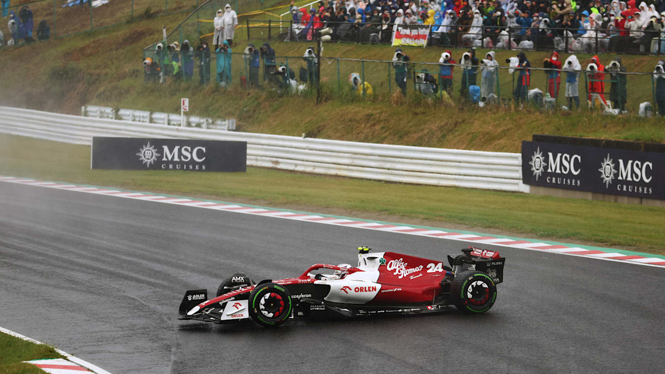 SUZUKA, JAPAN - OCTOBER 09: Zhou Guanyu of China driving the (24) Alfa Romeo F1 C42 Ferrari spins during the F1 Grand Prix of Japan at Suzuka International Racing Course on October 09, 2022 in Suzuka, Japan. (Photo by Bryn Lennon - Formula 1/Formula 1 via Getty Images)