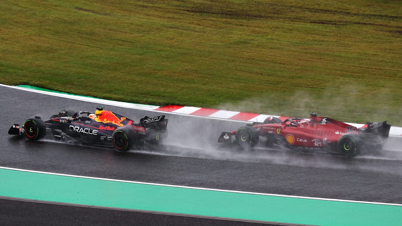 SUZUKA, JAPAN - OCTOBER 09: Max Verstappen of the Netherlands driving the (1) Oracle Red Bull Racing RB18 leads Charles Leclerc of Monaco driving the (16) Ferrari F1-75 on lap one during the F1 Grand Prix of Japan at Suzuka International Racing Course on October 09, 2022 in Suzuka, Japan. (Photo by Clive Rose/Getty Images)