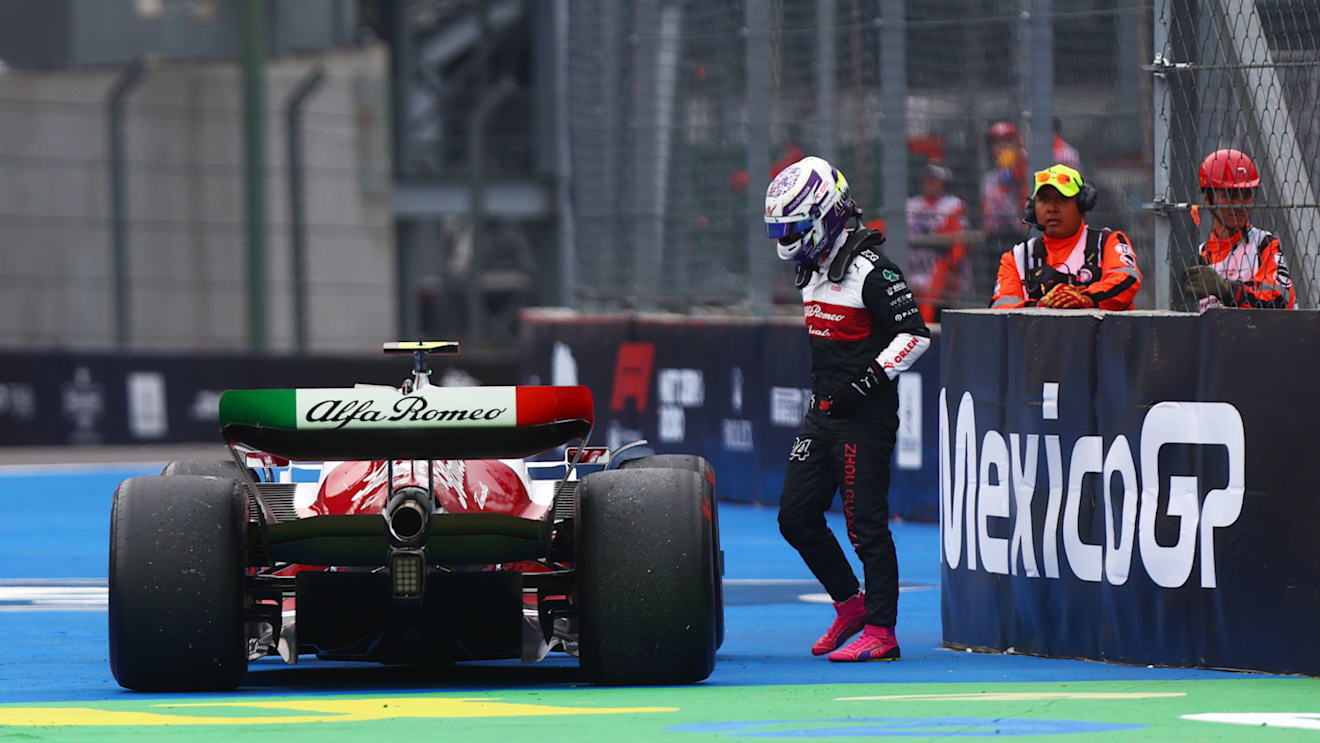 MEXICO CITY, MEXICO - OCTOBER 28: Zhou Guanyu of China and Alfa Romeo F1 walks from his car after stopping on track during practice ahead of the F1 Grand Prix of Mexico at Autodromo Hermanos Rodriguez on October 28, 2022 in Mexico City, Mexico. (Photo by Dan Istitene - Formula 1/Formula 1 via Getty Images)