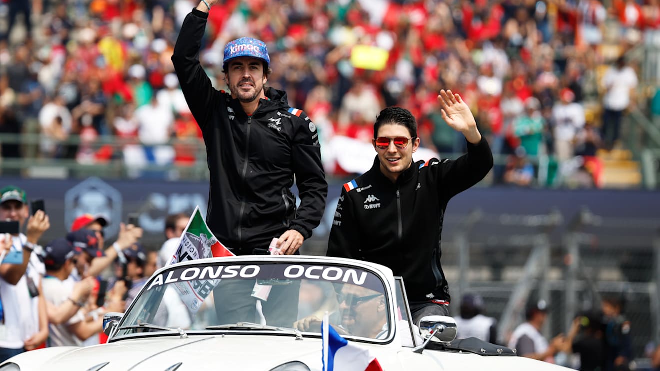 MEXICO CITY, MEXICO - OCTOBER 30: Fernando Alonso of Spain and Alpine F1 and Esteban Ocon of France and Alpine F1 wave to the crowd on the drivers parade prior to the F1 Grand Prix of Mexico at Autodromo Hermanos Rodriguez on October 30, 2022 in Mexico City, Mexico. (Photo by Jared C. Tilton/Getty Images)