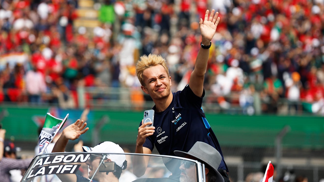 MEXICO CITY, MEXICO - OCTOBER 30: Nicholas Latifi of Canada and Williams and Alexander Albon of Thailand and Williams wave to the crowd on the drivers parade prior to the F1 Grand Prix of Mexico at Autodromo Hermanos Rodriguez on October 30, 2022 in Mexico City, Mexico. (Photo by Jared C. Tilton/Getty Images)
