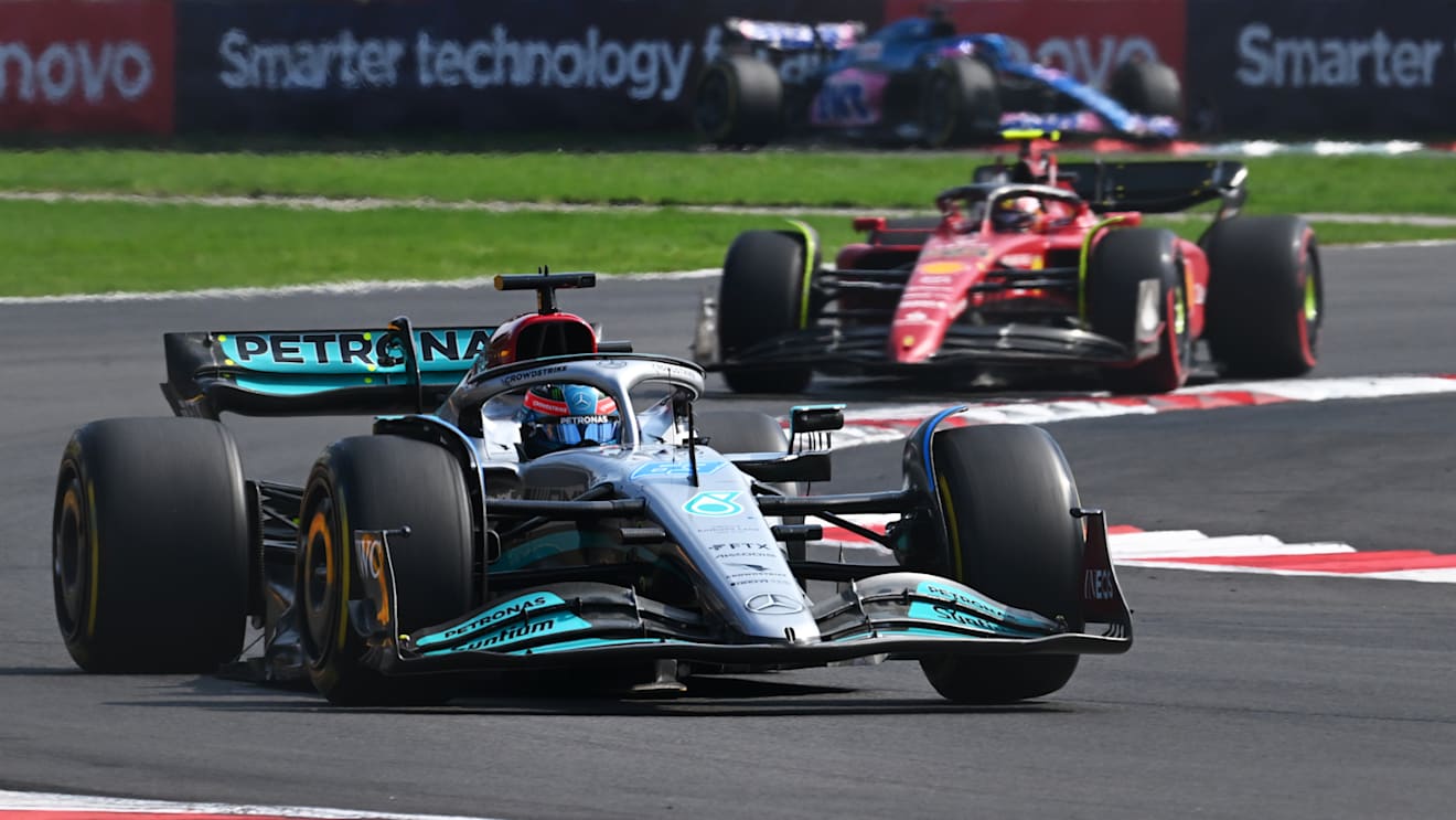 MEXICO CITY, MEXICO - OCTOBER 30: George Russell of Great Britain driving the (63) Mercedes AMG Petronas F1 Team W13 leads Carlos Sainz of Spain driving (55) the Ferrari F1-75 on track during the F1 Grand Prix of Mexico at Autodromo Hermanos Rodriguez on October 30, 2022 in Mexico City, Mexico. (Photo by Clive Mason - Formula 1/Formula 1 via Getty Images)
