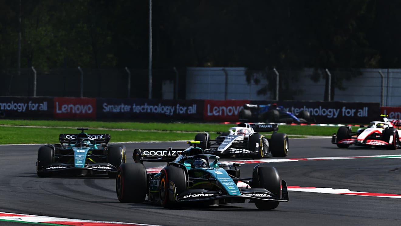 MEXICO CITY, MEXICO - OCTOBER 30: Sebastian Vettel of Germany driving the (5) Aston Martin AMR22 Mercedes leads Lance Stroll of Canada driving the (18) Aston Martin AMR22 Mercedes on track during the F1 Grand Prix of Mexico at Autodromo Hermanos Rodriguez on October 30, 2022 in Mexico City, Mexico. (Photo by Clive Mason - Formula 1/Formula 1 via Getty Images)