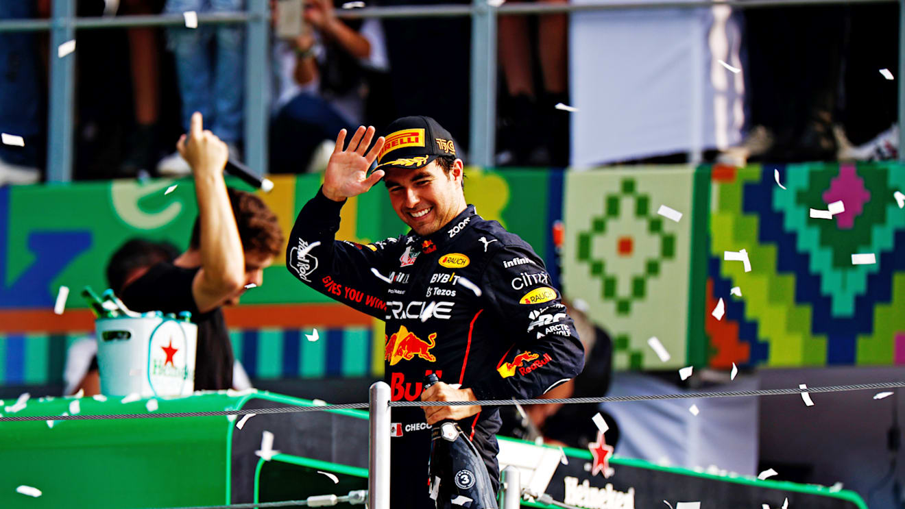 MEXICO CITY, MEXICO - OCTOBER 30: Third placed Sergio Perez of Mexico and Oracle Red Bull Racing celebrates on the podium during the F1 Grand Prix of Mexico at Autodromo Hermanos Rodriguez on October 30, 2022 in Mexico City, Mexico. (Photo by Clive Mason - Formula 1/Formula 1 via Getty Images)