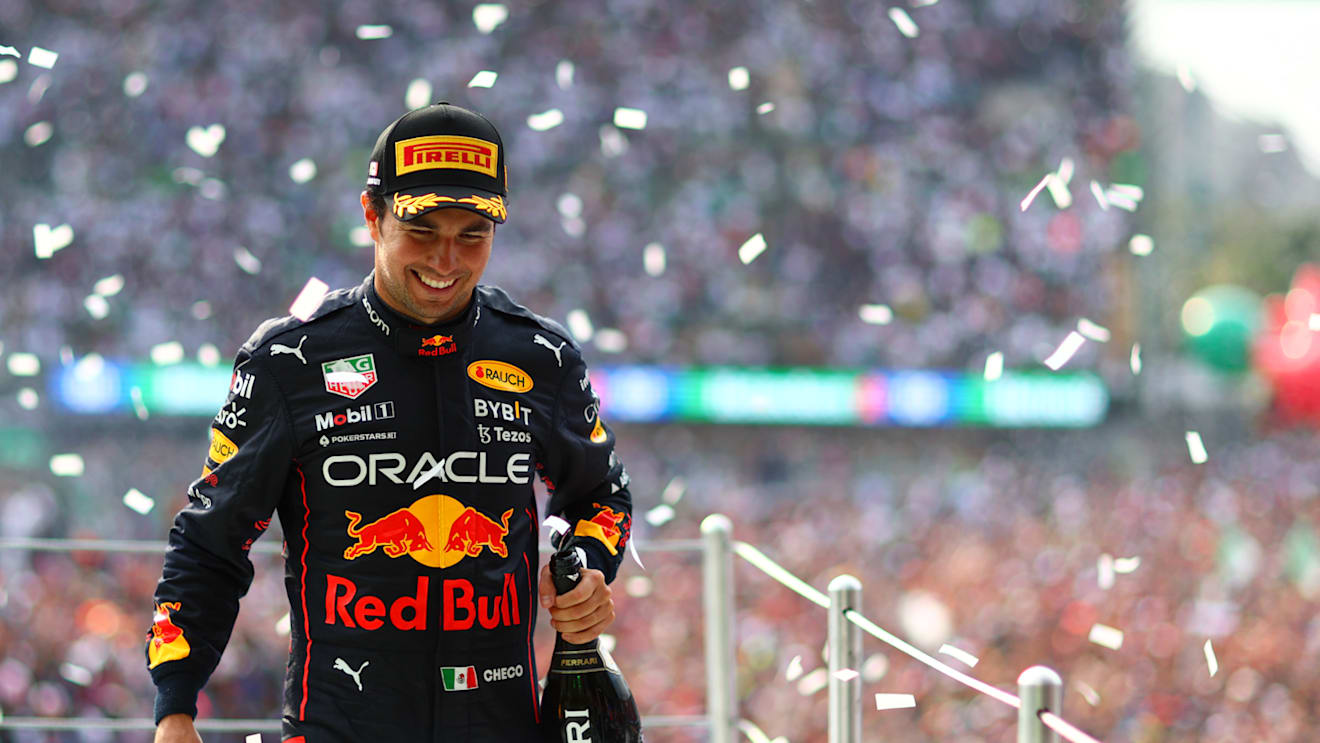 MEXICO CITY, MEXICO - OCTOBER 30: Third placed Sergio Perez of Mexico and Oracle Red Bull Racing celebrates on the podium after the F1 Grand Prix of Mexico at Autodromo Hermanos Rodriguez on October 30, 2022 in Mexico City, Mexico. (Photo by Dan Istitene - Formula 1/Formula 1 via Getty Images)