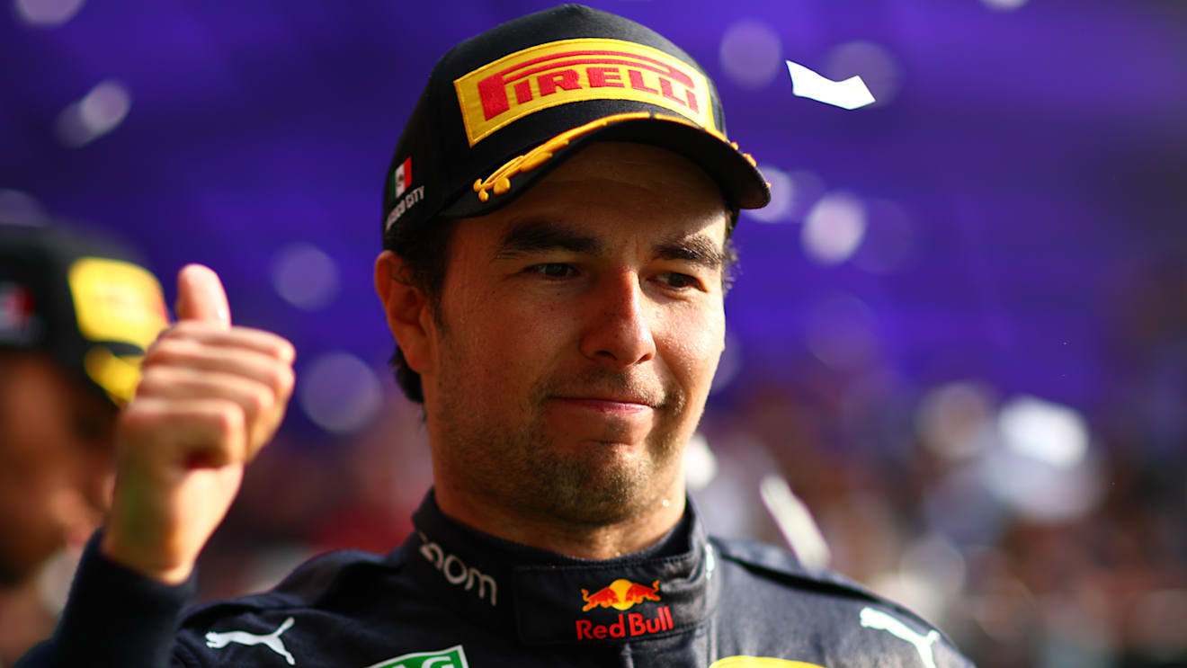 MEXICO CITY, MEXICO - OCTOBER 30: Third placed Sergio Perez of Mexico and Oracle Red Bull Racing celebrates on the podium after the F1 Grand Prix of Mexico at Autodromo Hermanos Rodriguez on October 30, 2022 in Mexico City, Mexico. (Photo by Dan Istitene - Formula 1/Formula 1 via Getty Images)
