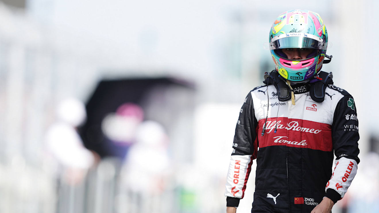 MIAMI, FLORIDA - MAY 07: 17th placed qualifier Zhou Guanyu of China and Alfa Romeo F1 walks in the Pitlane during qualifying ahead of the F1 Grand Prix of Miami at the Miami International Autodrome on May 07, 2022 in Miami, Florida. (Photo by Mark Thompson/Getty Images)