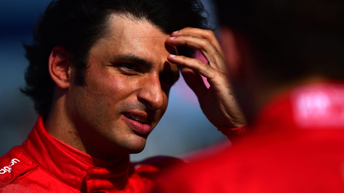 MIAMI, FLORIDA - MAY 07: Pole position qualifier Charles Leclerc of Monaco and Ferrari and Second placed qualifier Carlos Sainz of Spain and Ferrari talk in parc ferme during qualifying ahead of the F1 Grand Prix of Miami at the Miami International Autodrome on May 07, 2022 in Miami, Florida. (Photo by Mario Renzi - Formula 1/Formula 1 via Getty Images)