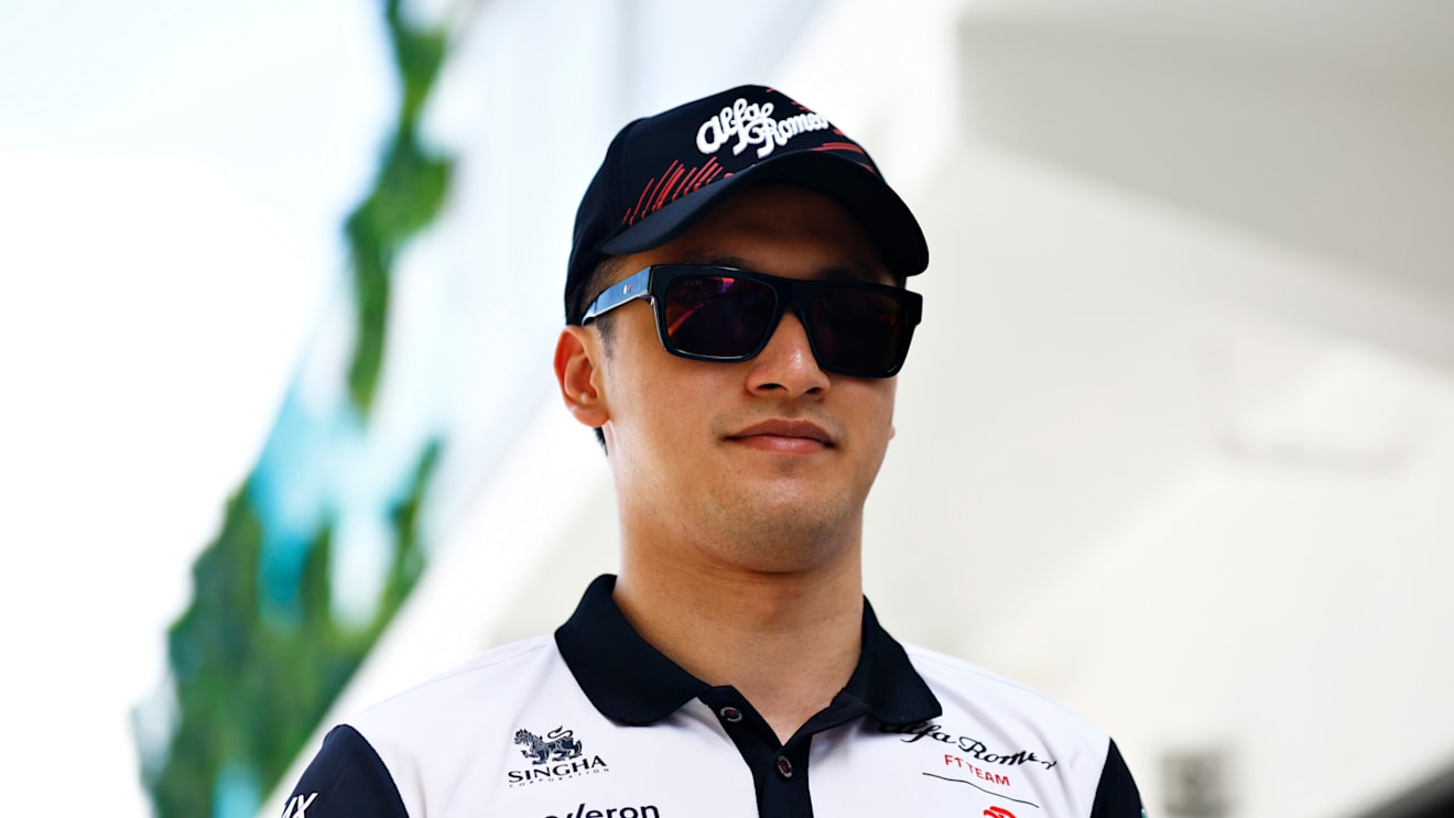 MIAMI, FLORIDA - MAY 08: Zhou Guanyu of China and Alfa Romeo F1 walks in the Paddock prior to the F1 Grand Prix of Miami at the Miami International Autodrome on May 08, 2022 in Miami, Florida. (Photo by Jared C. Tilton/Getty Images)