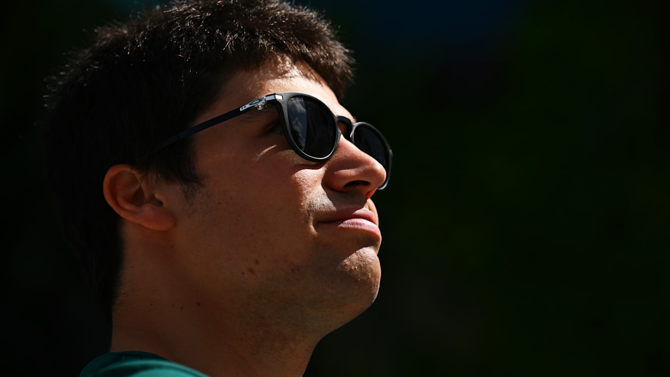 MIAMI, FLORIDA - MAY 08: Lance Stroll of Canada and Aston Martin F1 Team looks on in the Paddock prior to the F1 Grand Prix of Miami at the Miami International Autodrome on May 08, 2022 in Miami, Florida. (Photo by Clive Mason - Formula 1/Formula 1 via Getty Images)