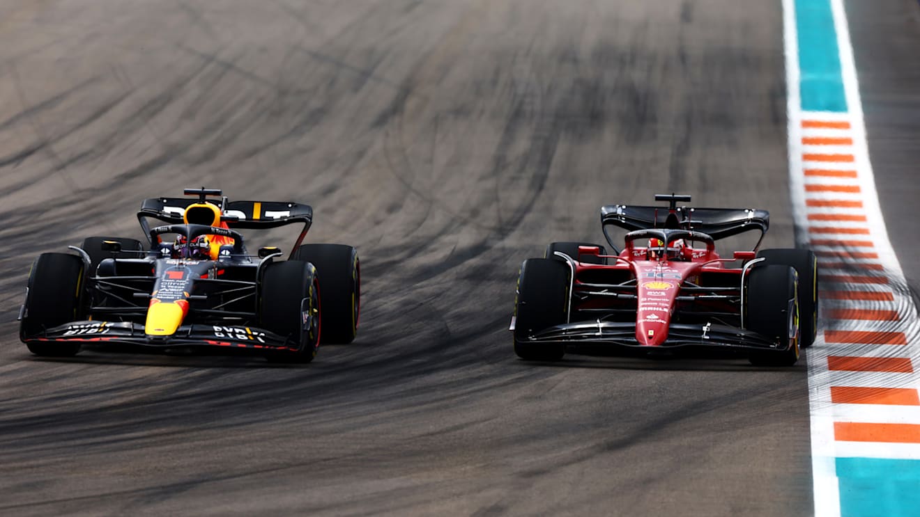 MIAMI, FLORIDA - MAY 08: Max Verstappen of the Netherlands driving the (1) Oracle Red Bull Racing RB18 and Charles Leclerc of Monaco driving (16) the Ferrari F1-75 compete for position on track during the F1 Grand Prix of Miami at the Miami International Autodrome on May 08, 2022 in Miami, Florida. (Photo by Mark Thompson/Getty Images)