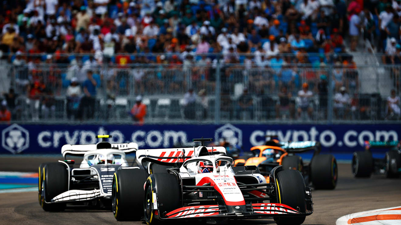 MIAMI, FLORIDA - MAY 08: Kevin Magnussen of Denmark driving the (20) Haas F1 VF-22 Ferrari leads Yuki Tsunoda of Japan driving the (22) Scuderia AlphaTauri AT03 during the F1 Grand Prix of Miami at the Miami International Autodrome on May 08, 2022 in Miami, Florida. (Photo by Jared C. Tilton/Getty Images)